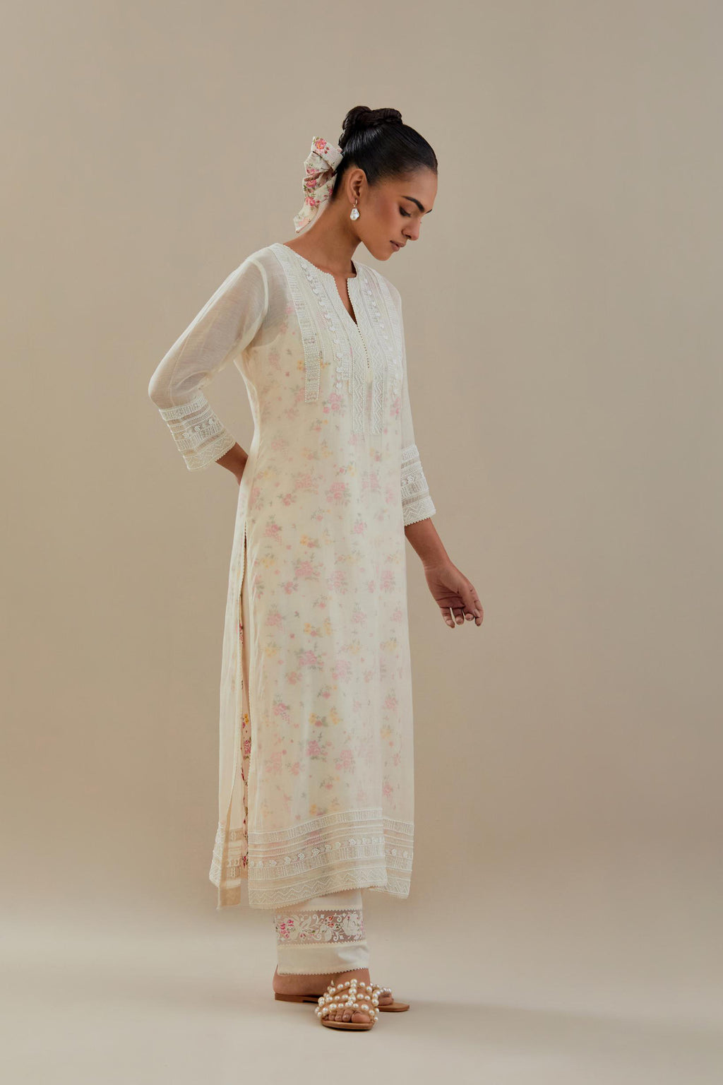 Off white cotton chanderi straight kurta set with off white thread embroidery and delicate beaded hand work at neck, sleeve and hem.