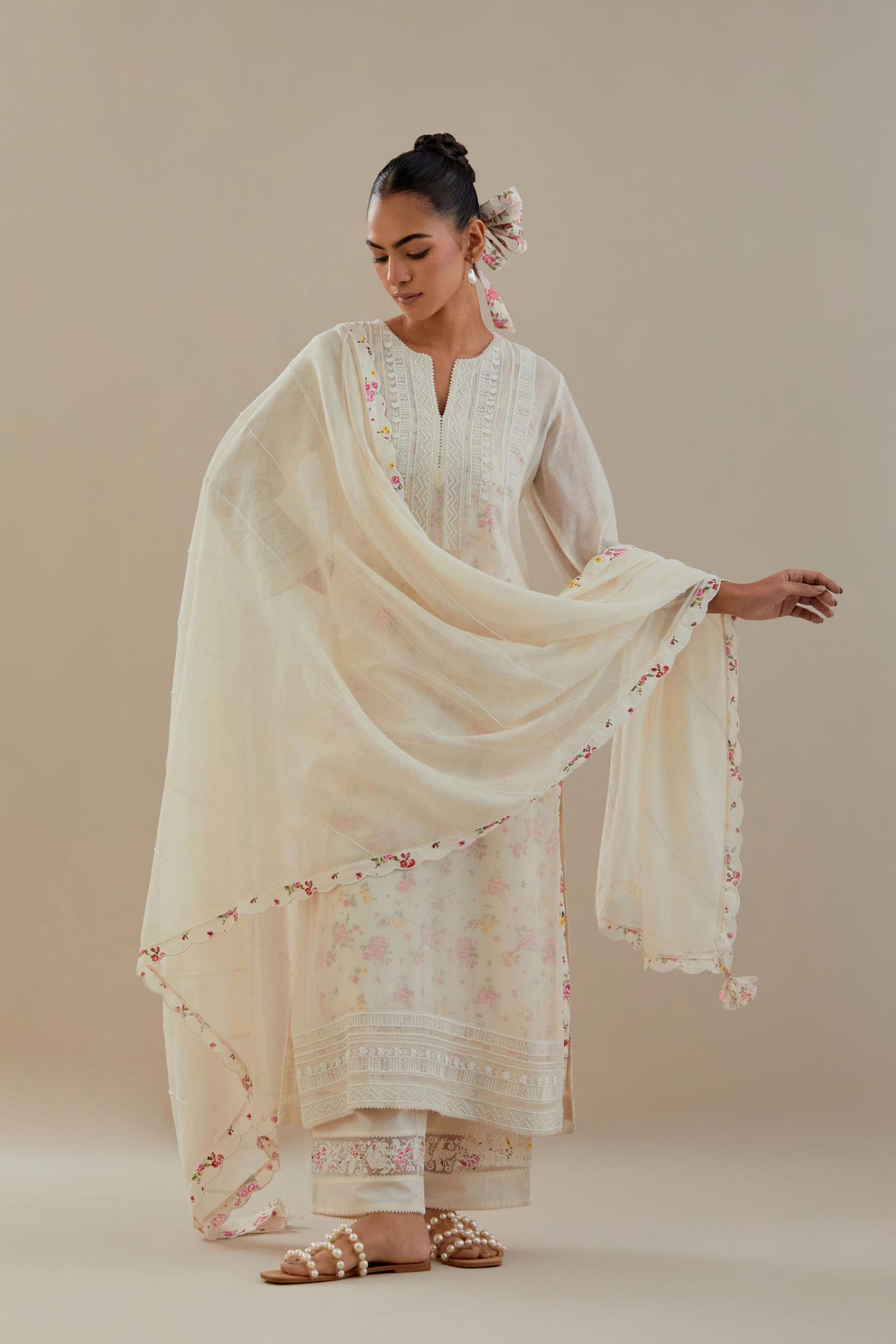 Off white cotton chanderi dupatta with hand block printed cotton scalloped edges and diagonal thread and bead work lines all-over the dupatta.