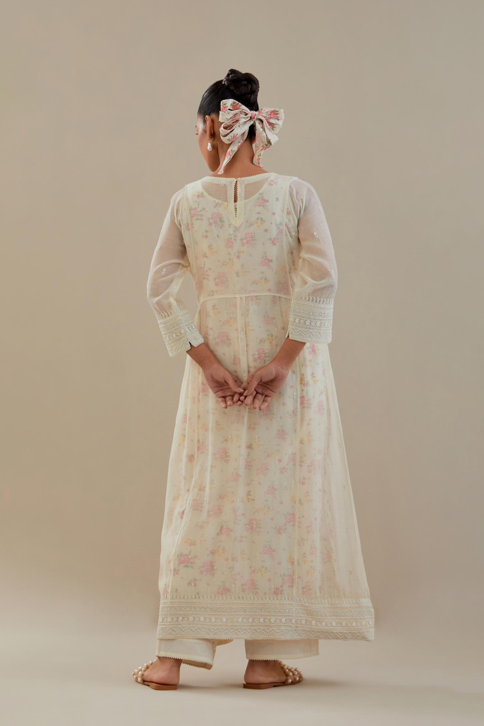 Off white cotton chanderi kurta set with hand block printed cotton slip inside, highlighted with all-over off white beads and thread embroidery.