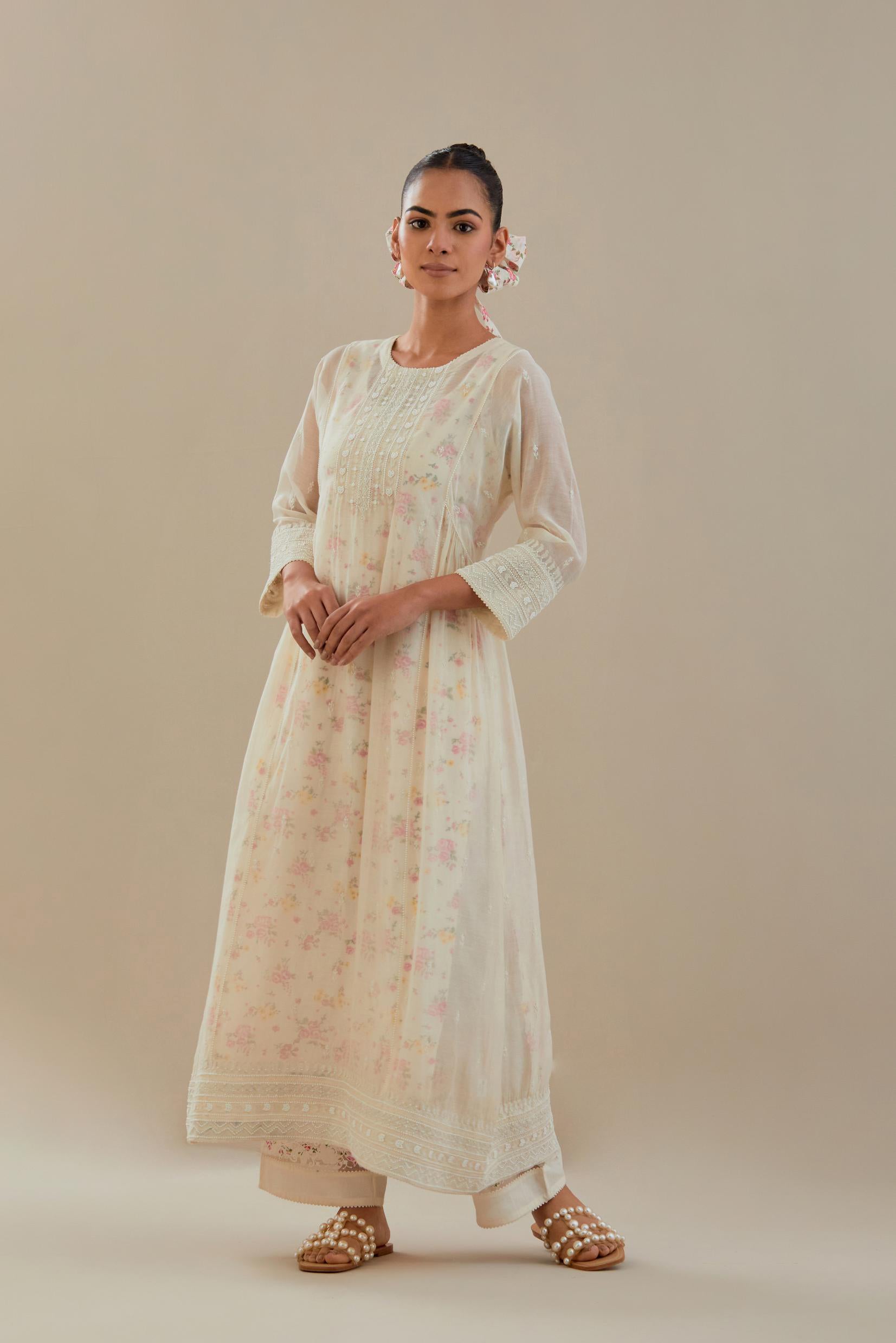 Off white cotton chanderi kurta set with hand block printed cotton slip inside, highlighted with all-over off white beads and thread embroidery.