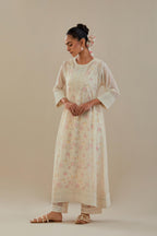 Off white cotton chanderi kurta set with hand block printed cotton slip inside, highlighted with all-over off white beads and thread embroidery.
