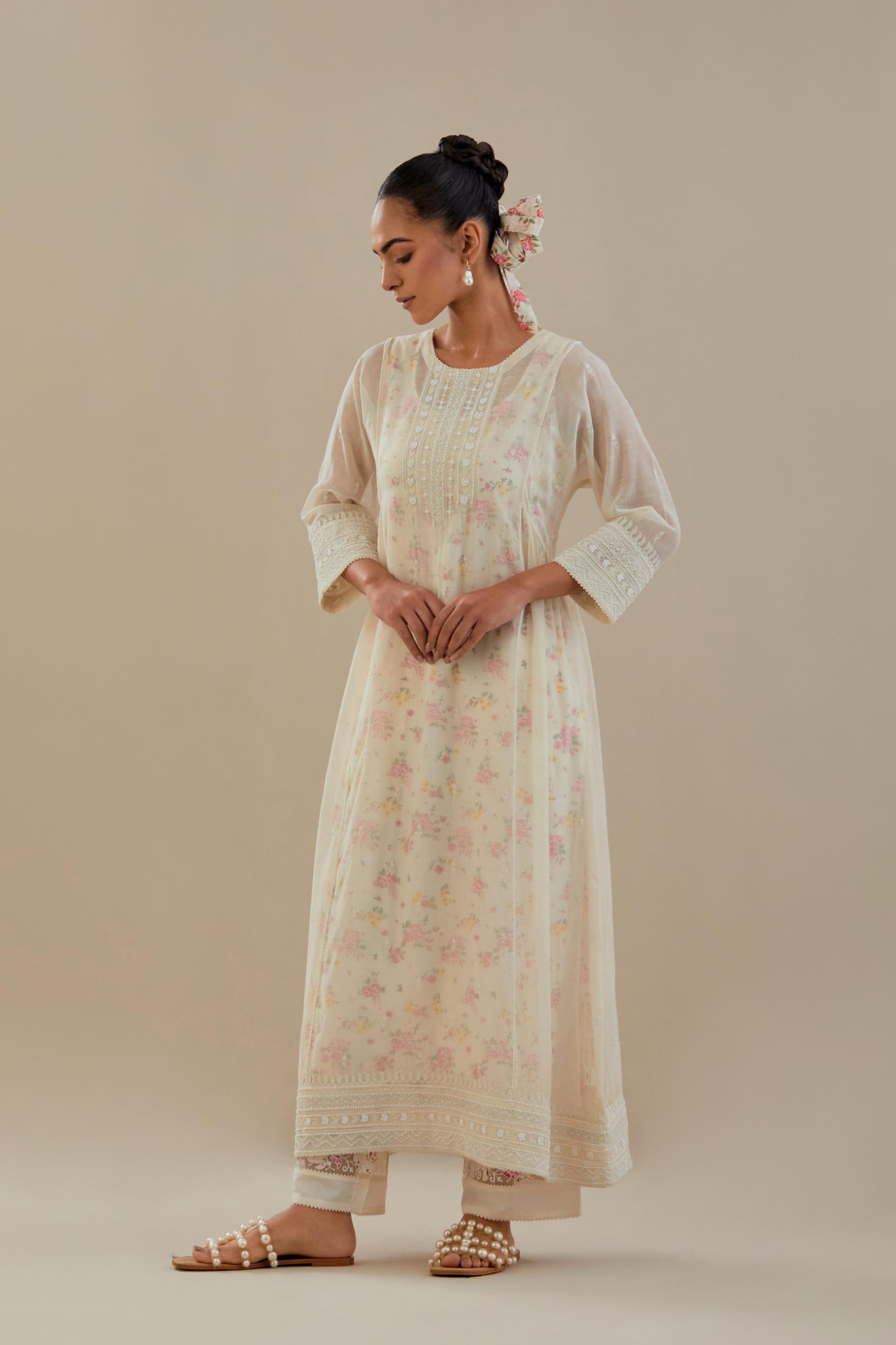 Off white cotton chanderi kurta set with hand block printed cotton slip inside, highlighted with all-over off white beads and thread embroidery.