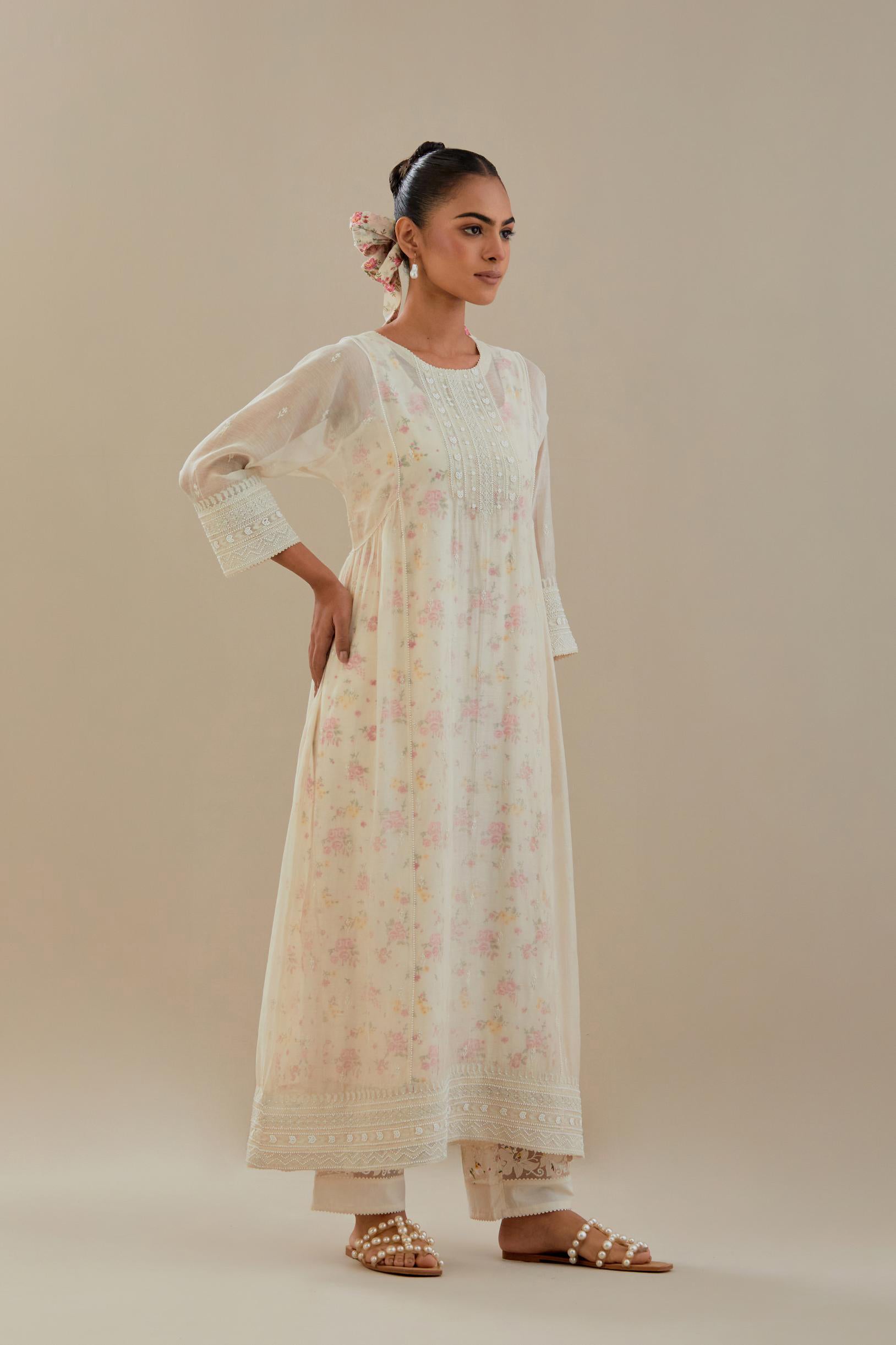 Off white cotton chanderi kurta set with hand block printed cotton slip inside, highlighted with all-over off white beads and thread embroidery.