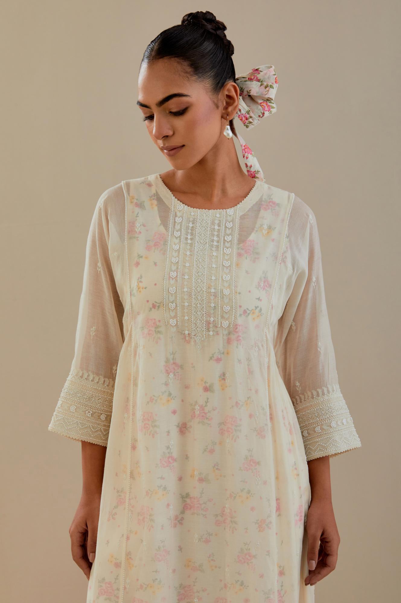 Off white cotton chanderi kurta set with hand block printed cotton slip inside, highlighted with all-over off white beads and thread embroidery.
