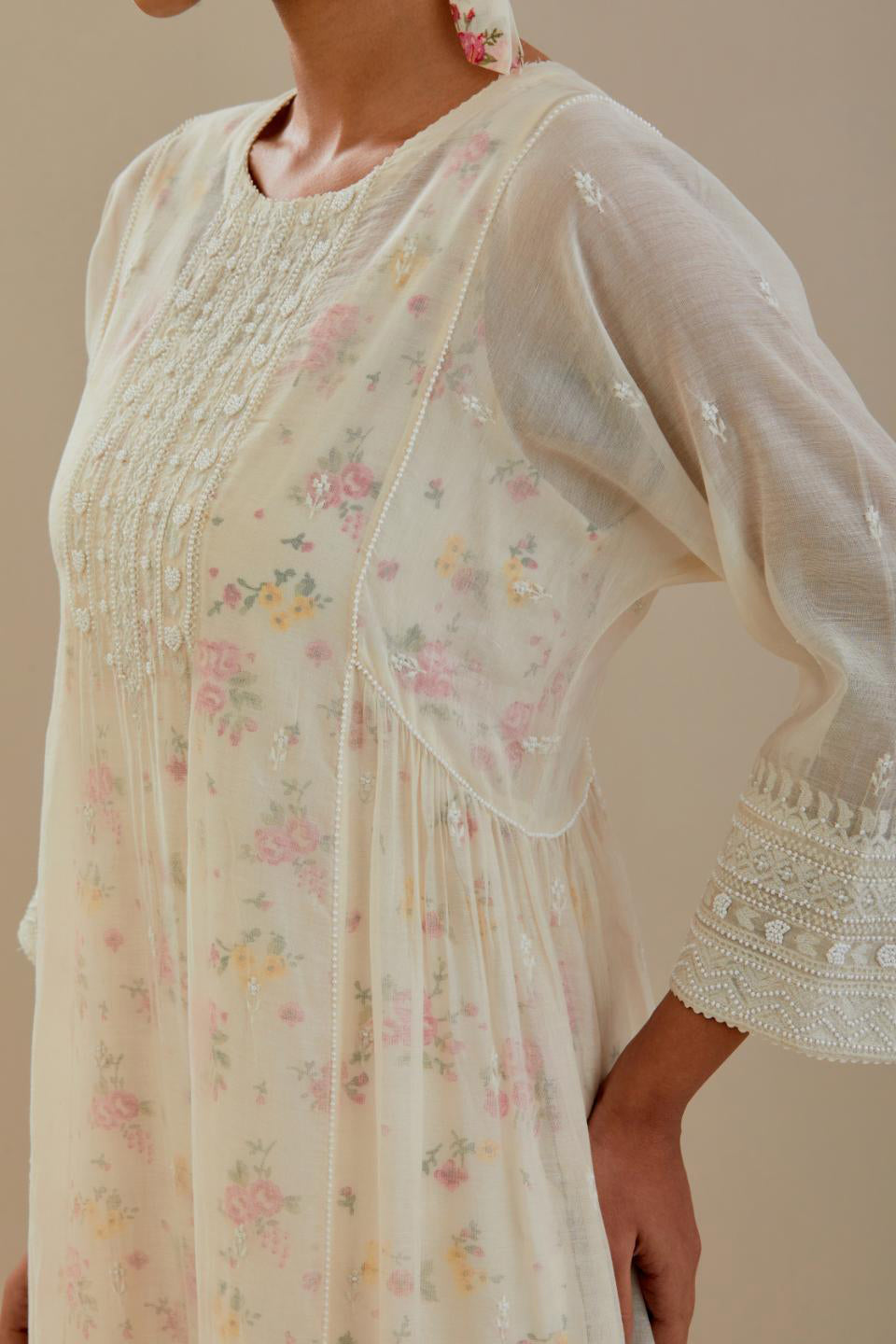 Off white cotton chanderi kurta set with hand block printed cotton slip inside, highlighted with all-over off white beads and thread embroidery.