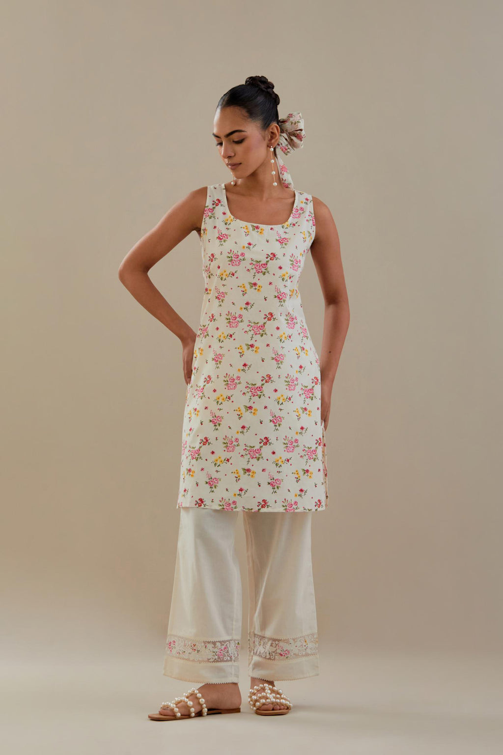 Off white cotton chanderi short kurta set, highlighted with delicate beads and thread embroidery.
