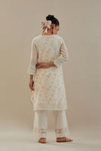 Off white cotton chanderi short kurta set, highlighted with delicate beads and thread embroidery.
