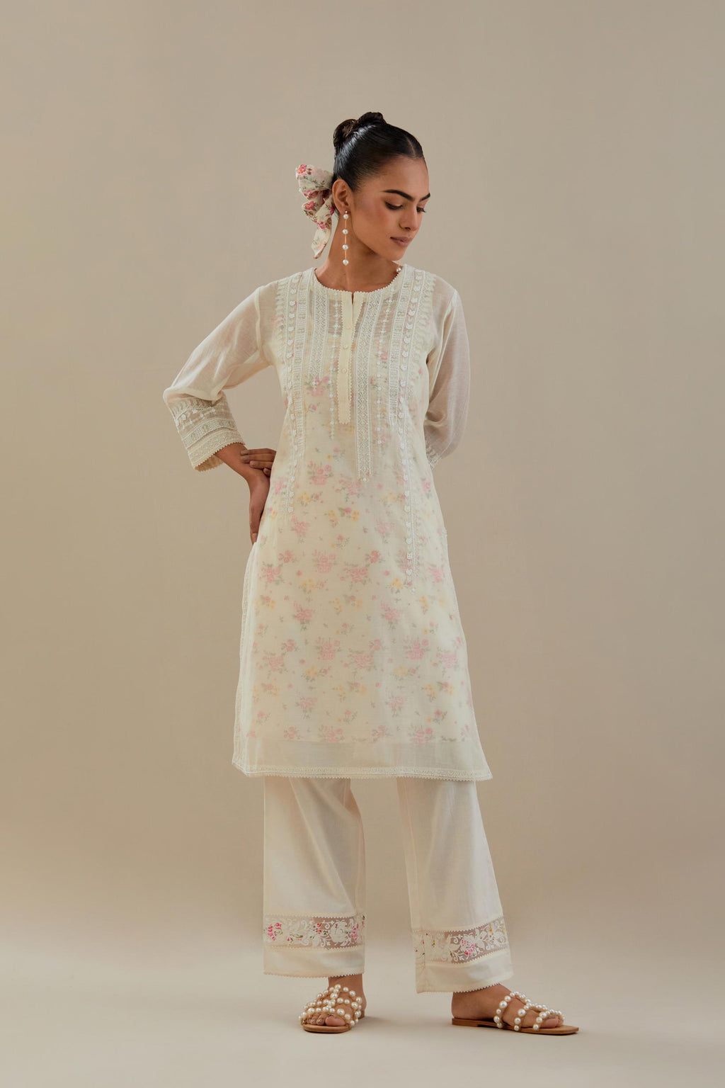 Off white cotton chanderi short kurta set, highlighted with delicate beads and thread embroidery.