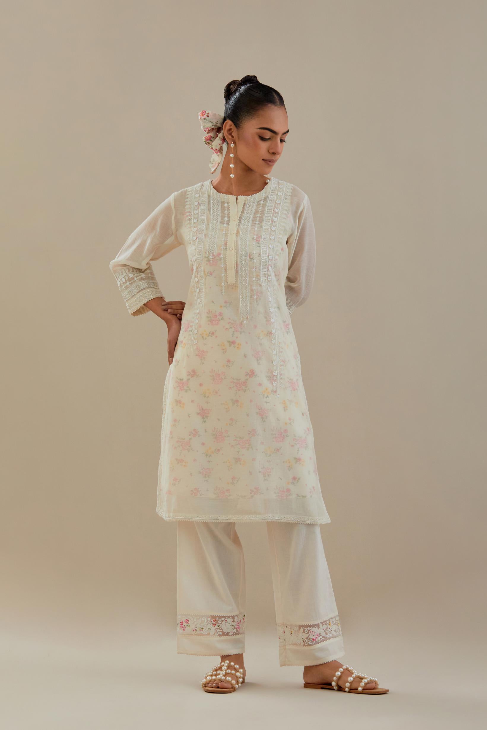 Off white cotton chanderi short kurta set, highlighted with delicate beads and thread embroidery.
