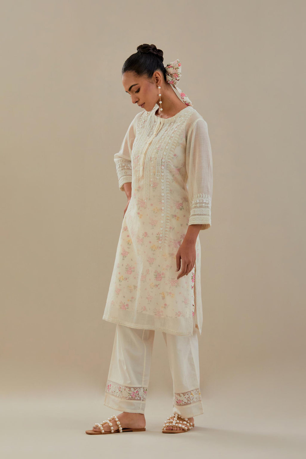 Off white cotton chanderi short kurta set, highlighted with delicate beads and thread embroidery.