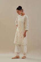 Off white cotton chanderi short kurta set, highlighted with delicate beads and thread embroidery.