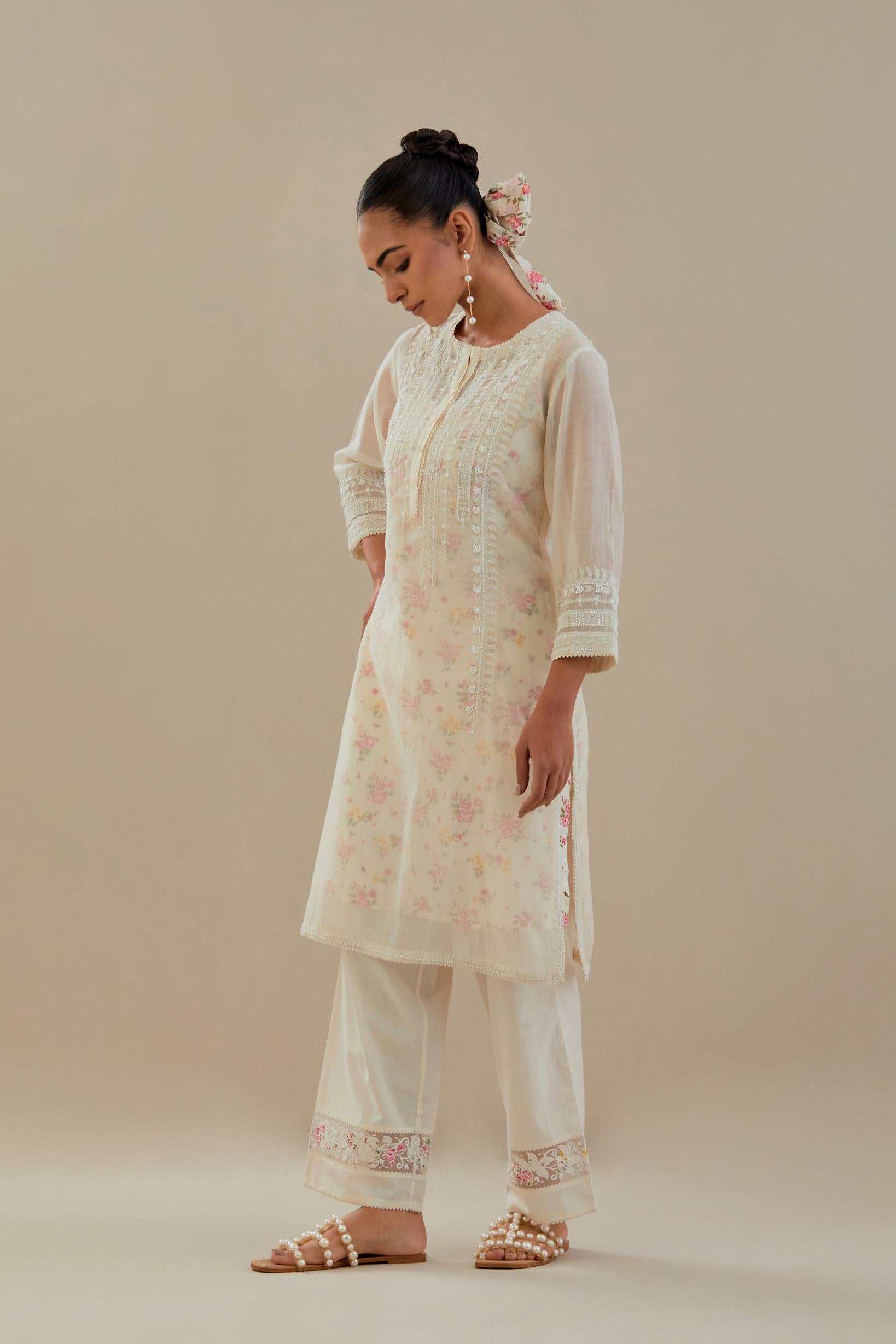 Off white cotton chanderi short kurta set, highlighted with delicate beads and thread embroidery.