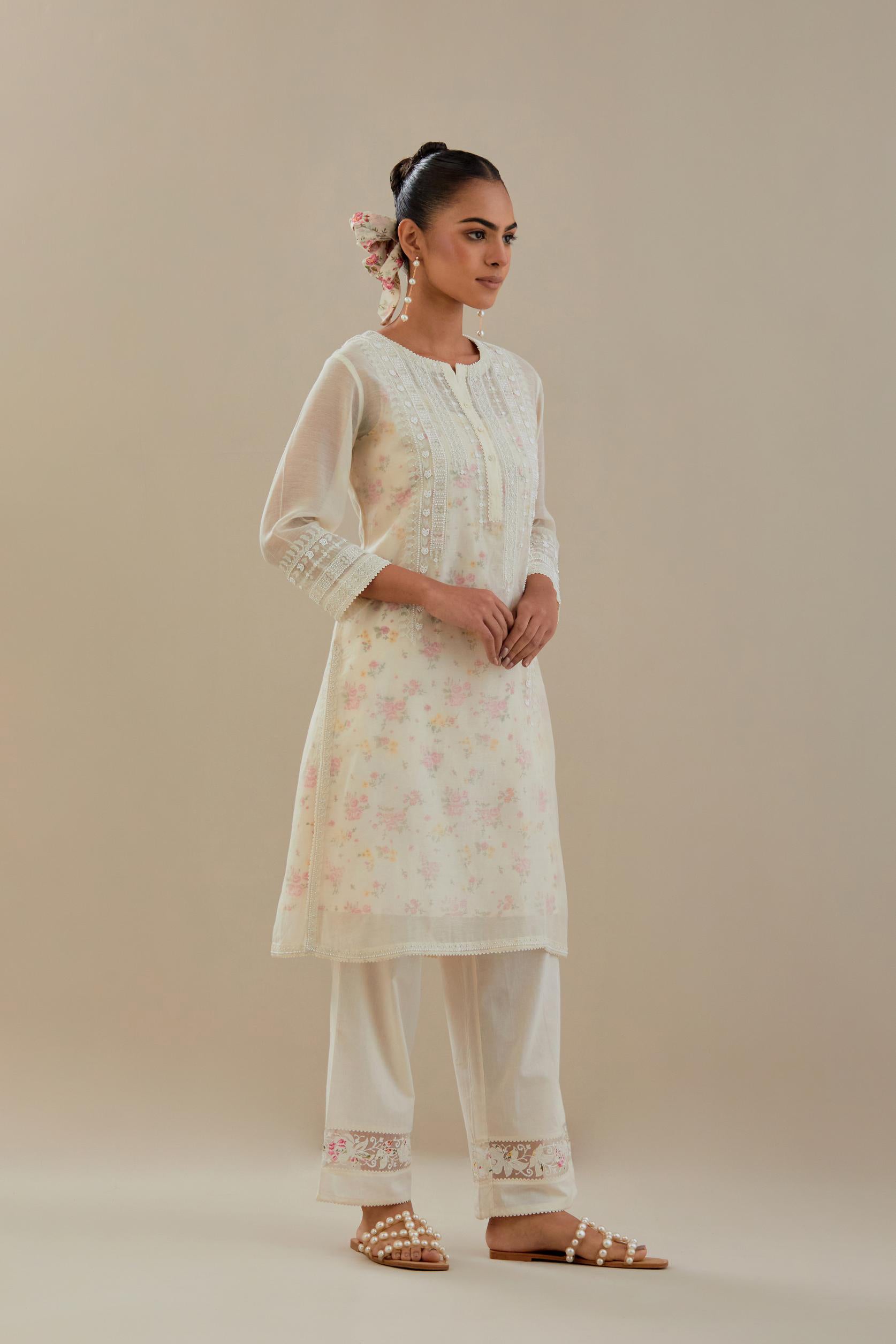 Off white cotton chanderi short kurta set, highlighted with delicate beads and thread embroidery.