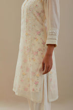 Off white cotton chanderi short kurta set, highlighted with delicate beads and thread embroidery.