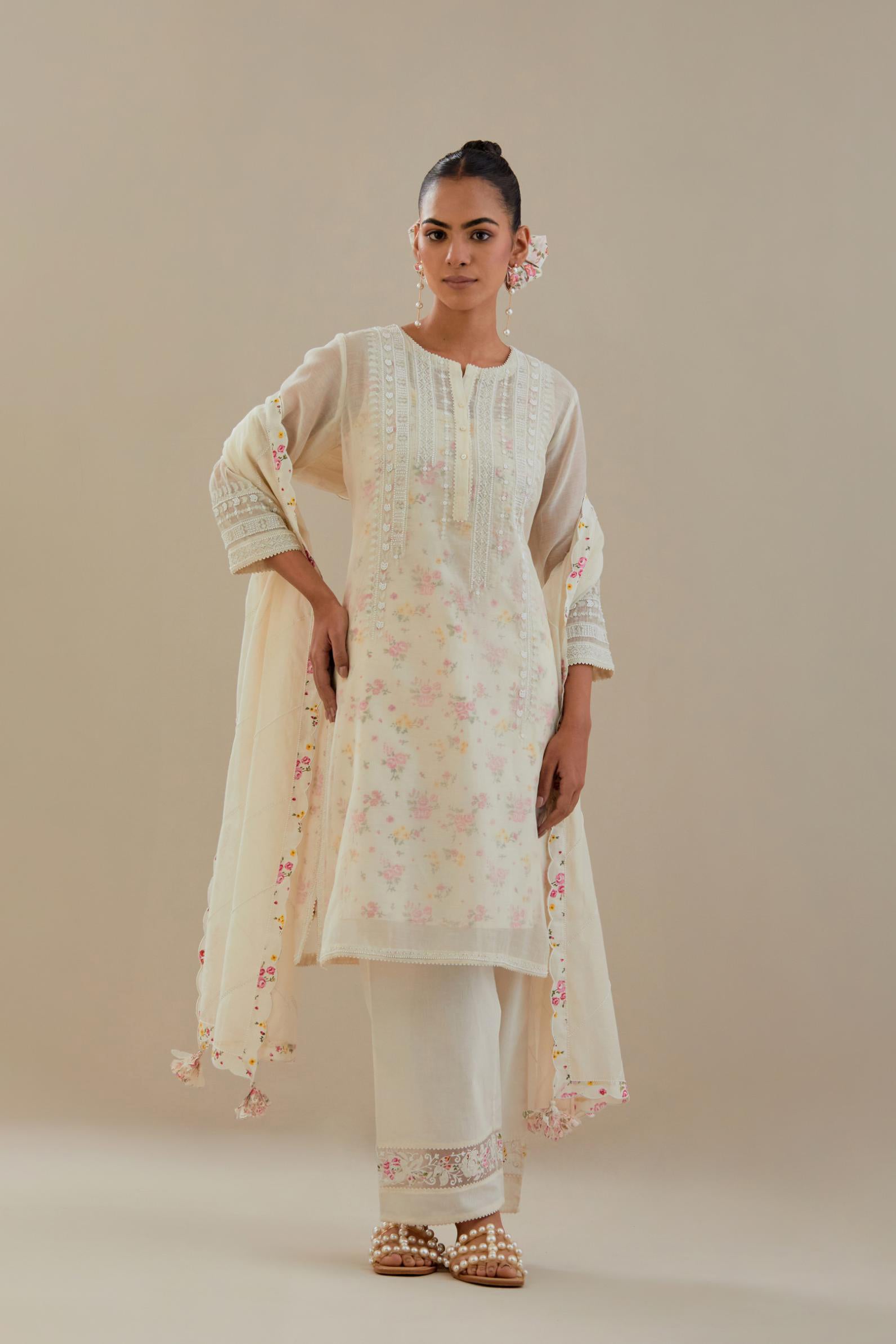 Off white cotton chanderi short kurta set, highlighted with delicate beads and thread embroidery.