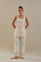 Off white cotton Chanderi short Angrakha kurta set with all-over off white beads and thread embroidery.