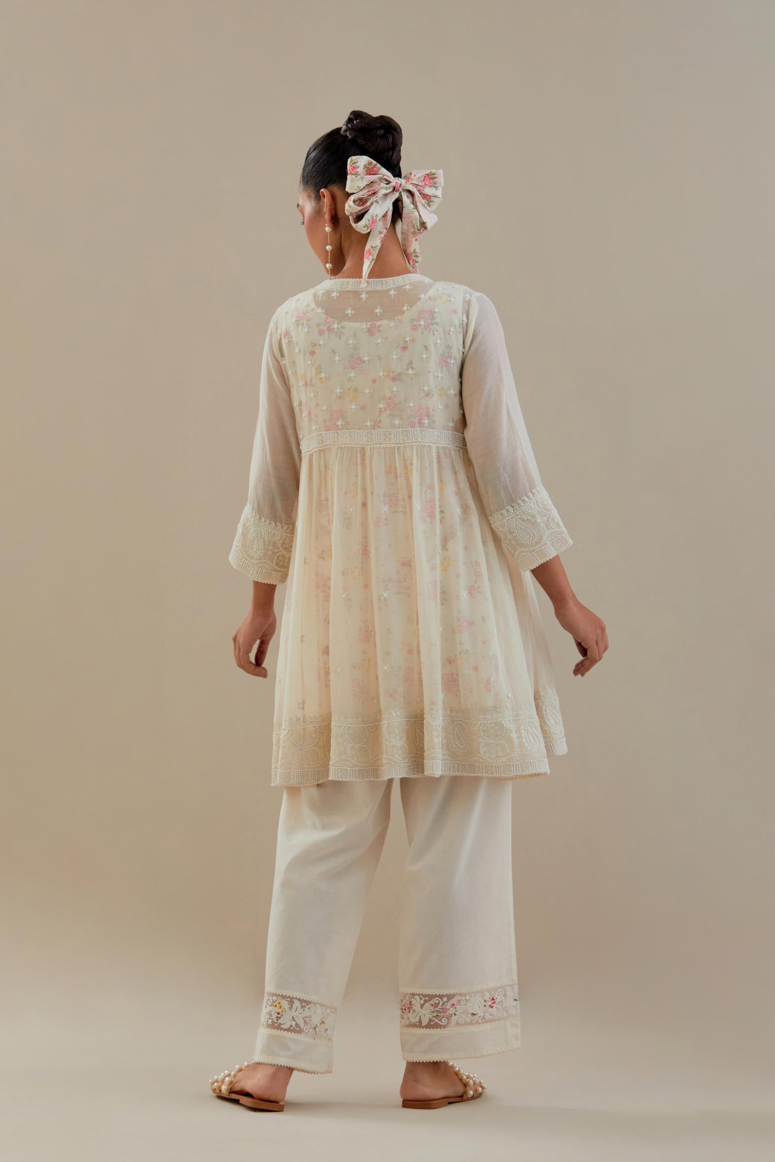 Off white cotton Chanderi short Angrakha kurta set with all-over off white beads and thread embroidery.