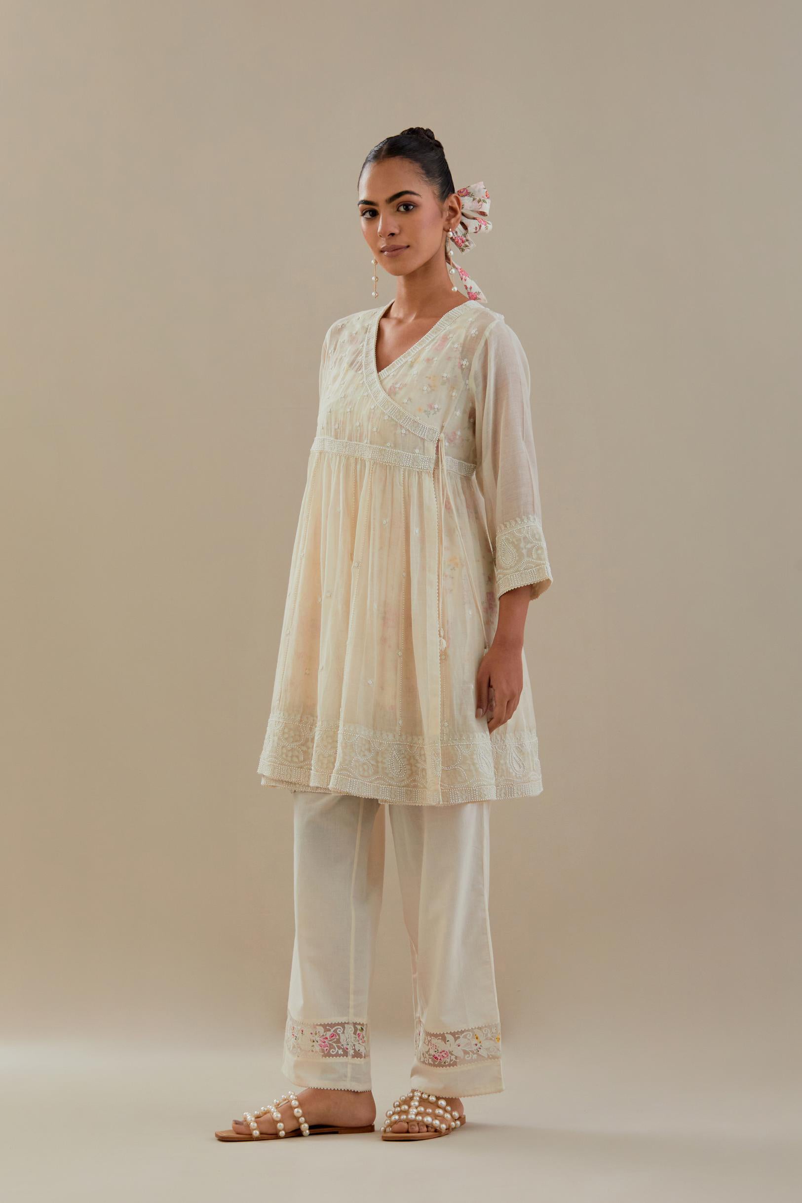 Off white cotton Chanderi short Angrakha kurta set with all-over off white beads and thread embroidery.