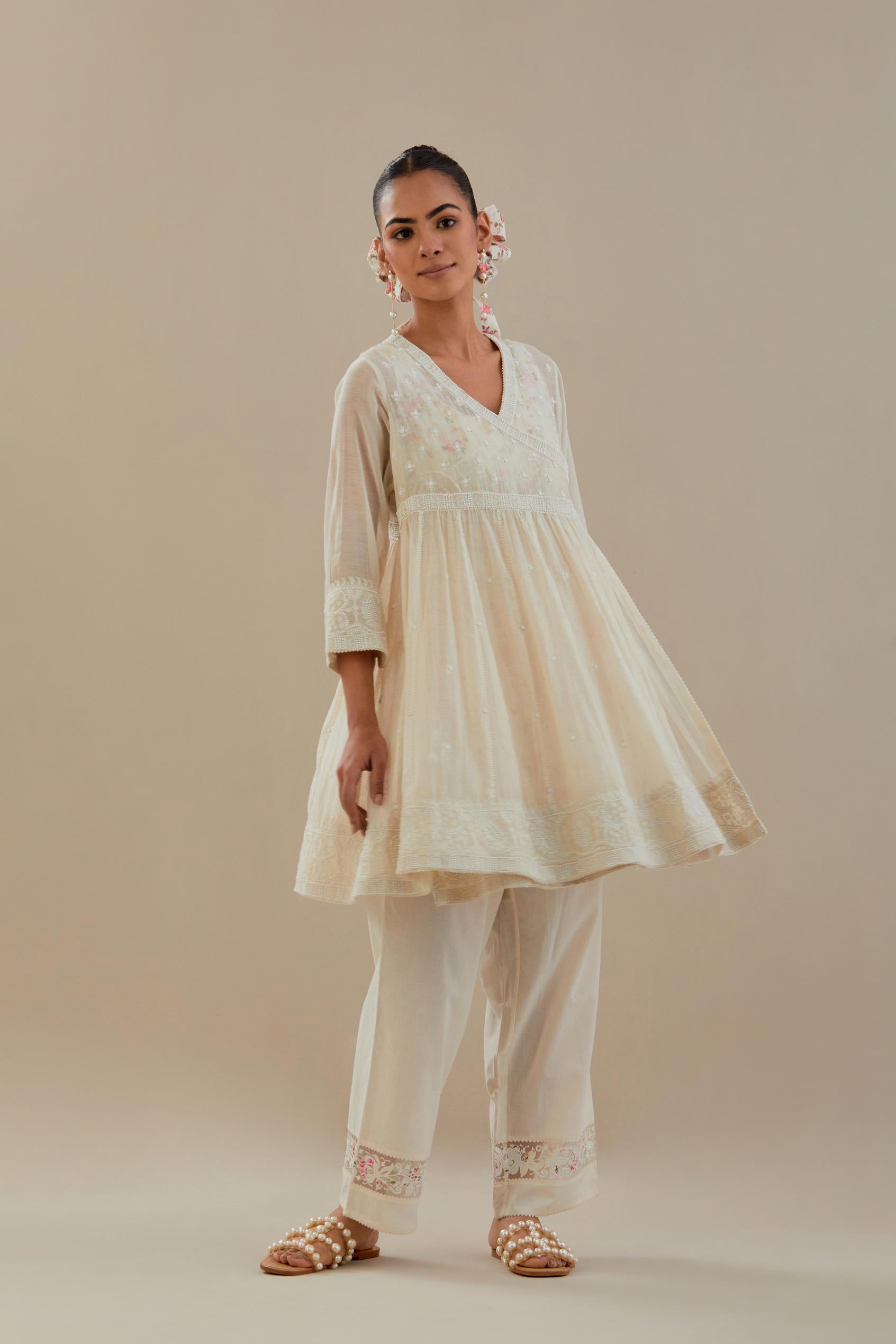 Off white cotton Chanderi short Angrakha kurta set with all-over off white beads and thread embroidery.