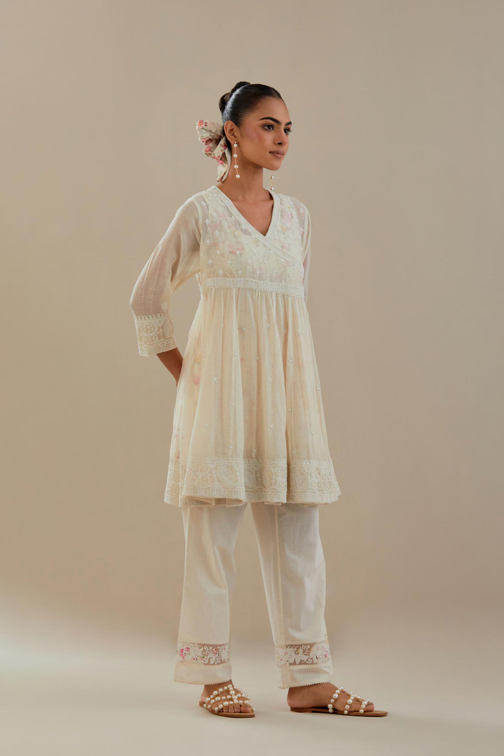 Off white cotton Chanderi short Angrakha kurta set with all-over off white beads and thread embroidery.
