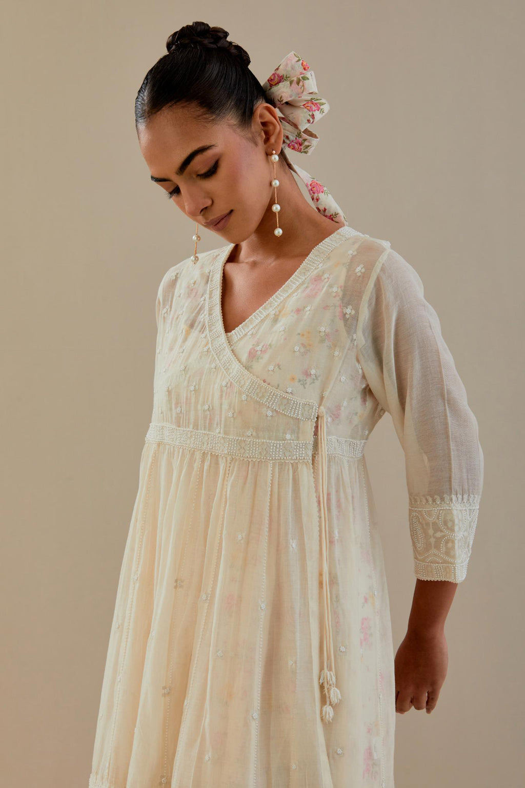 Off white cotton Chanderi short Angrakha kurta set with all-over off white beads and thread embroidery.