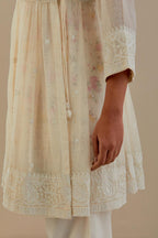 Off white cotton Chanderi short Angrakha kurta set with all-over off white beads and thread embroidery.