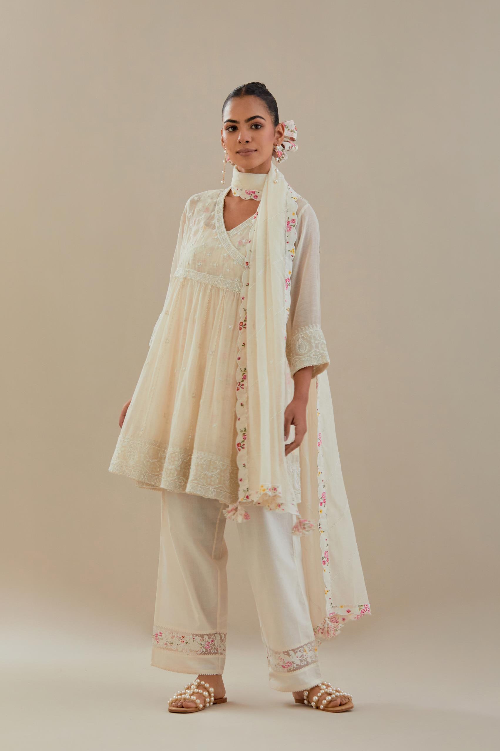 Off white cotton Chanderi short Angrakha kurta set with all-over off white beads and thread embroidery.
