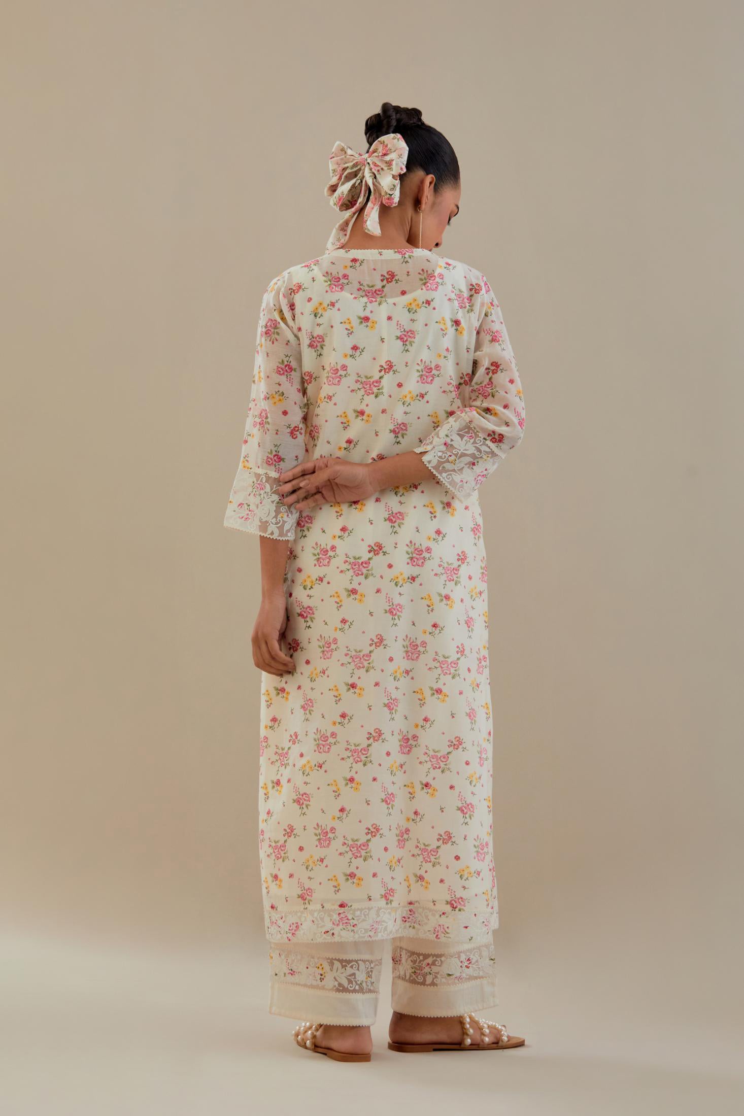 Off white cotton chanderi kurta set with small floral hand block print, highlighted with applique embroidery and ricrac lace.