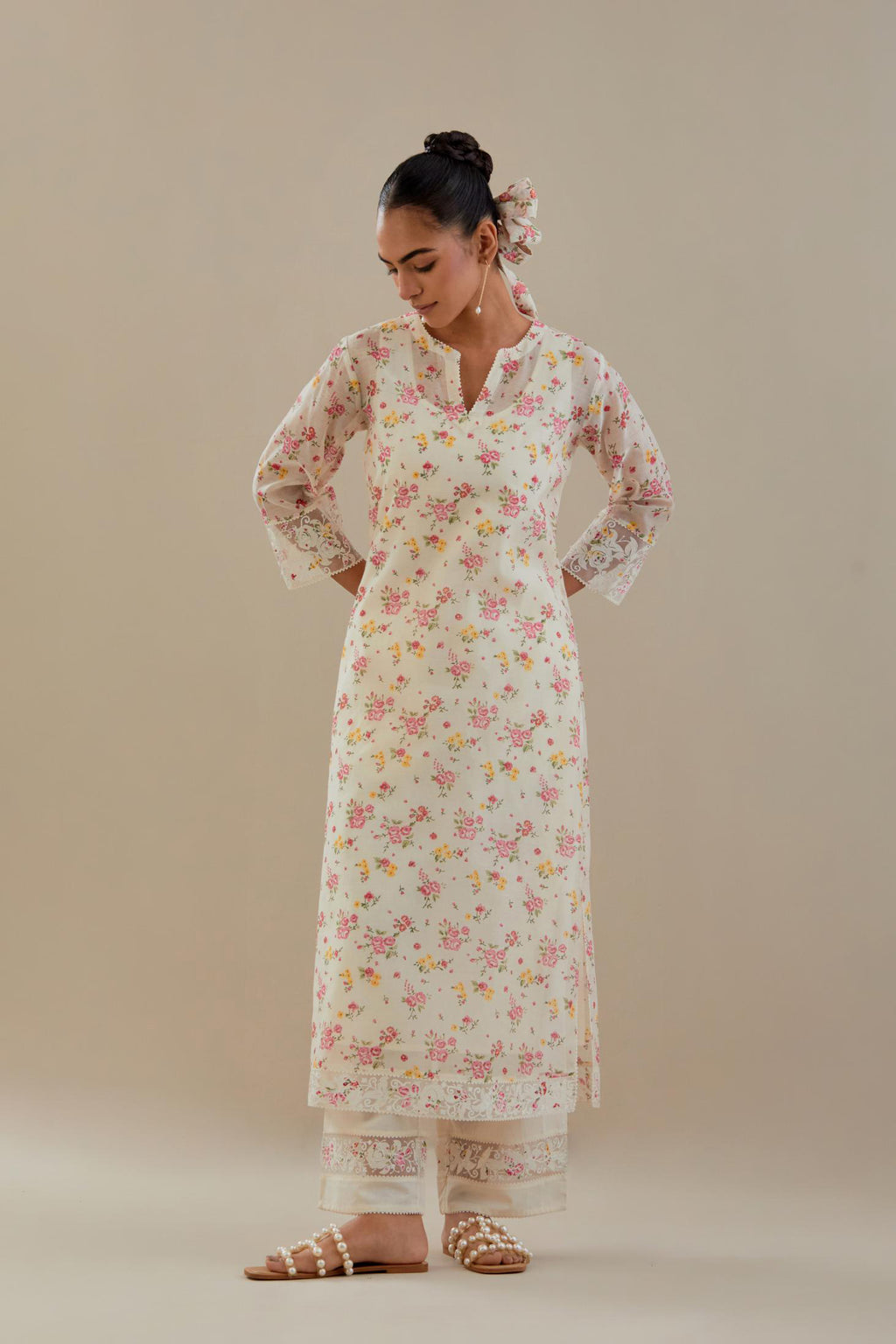 Off white cotton chanderi kurta set with small floral hand block print, highlighted with applique embroidery and ricrac lace.