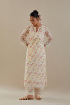 Off white cotton chanderi kurta set with small floral hand block print, highlighted with applique embroidery and ricrac lace.