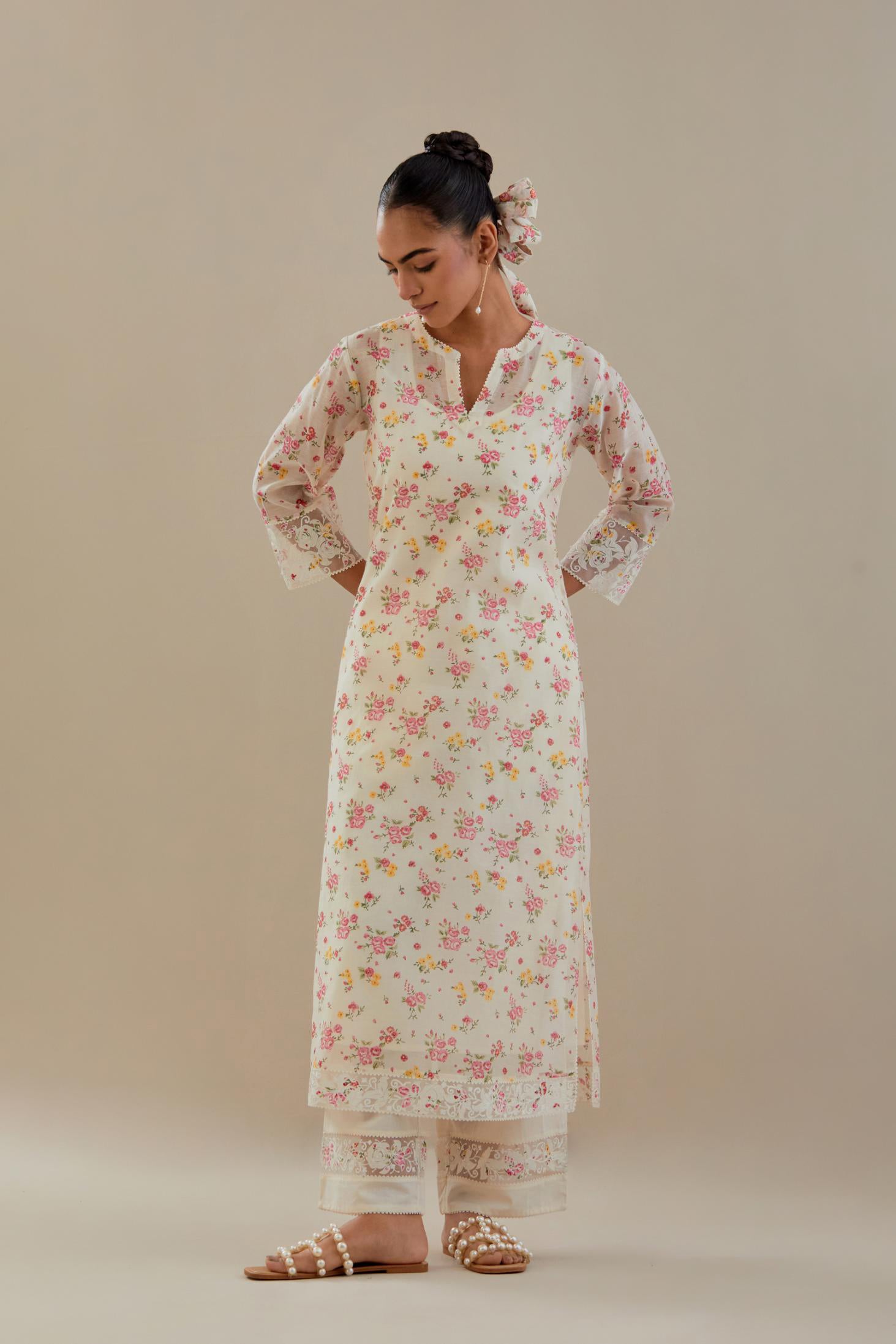 Off white cotton chanderi kurta set with small floral hand block print, highlighted with applique embroidery and ricrac lace.