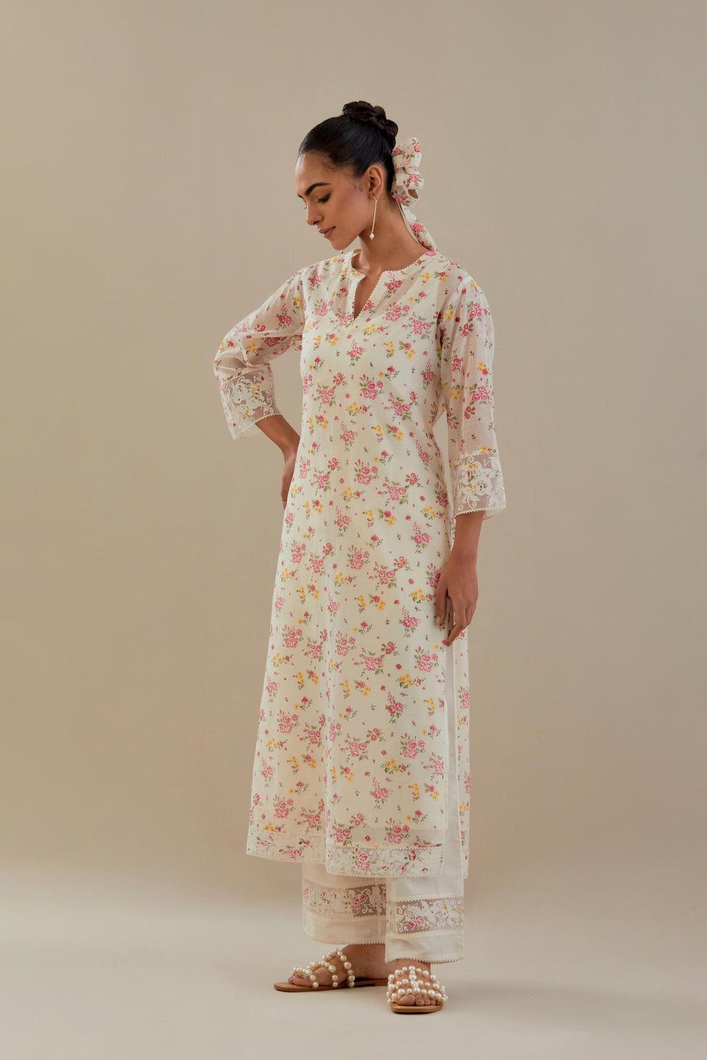 Off white cotton chanderi kurta set with small floral hand block print, highlighted with applique embroidery and ricrac lace.