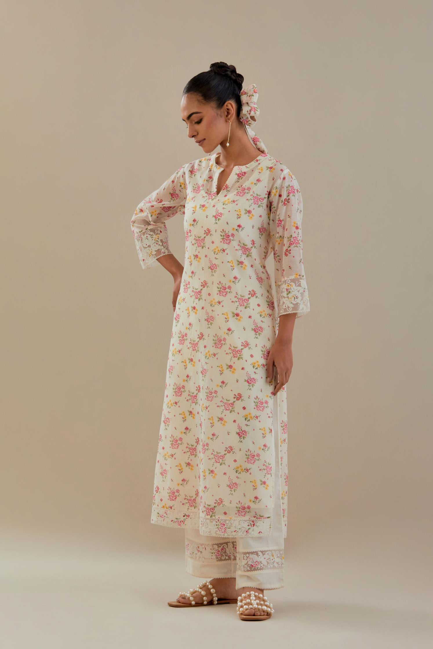 Off white cotton chanderi kurta set with small floral hand block print, highlighted with applique embroidery and ricrac lace.