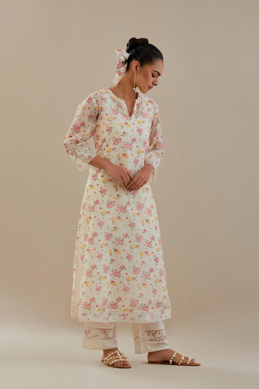 Off white cotton chanderi kurta set with small floral hand block print, highlighted with applique embroidery and ricrac lace.
