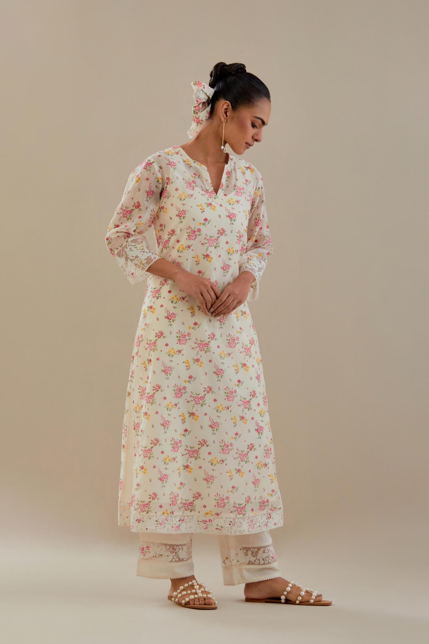 Off white cotton chanderi kurta set with small floral hand block print, highlighted with applique embroidery and ricrac lace.