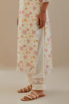 Off white cotton chanderi kurta set with small floral hand block print, highlighted with applique embroidery and ricrac lace.