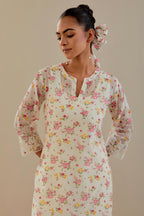 Off white cotton chanderi kurta set with small floral hand block print, highlighted with applique embroidery and ricrac lace.
