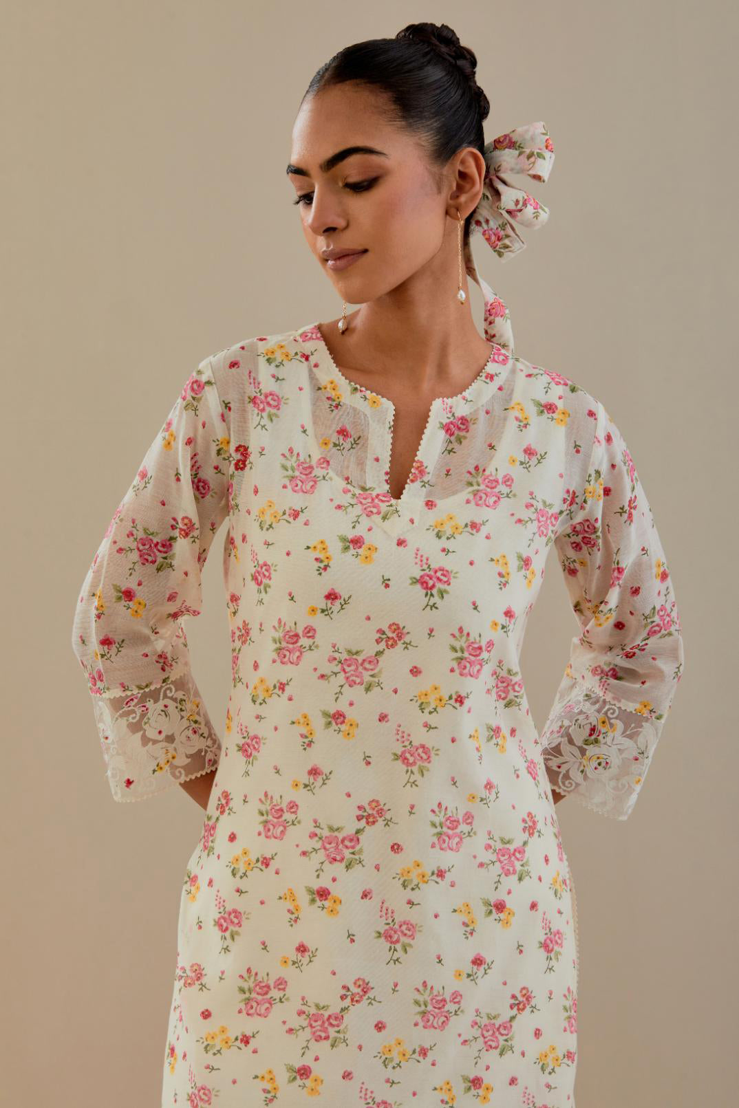 Off white cotton chanderi kurta set with small floral hand block print, highlighted with applique embroidery and ricrac lace.