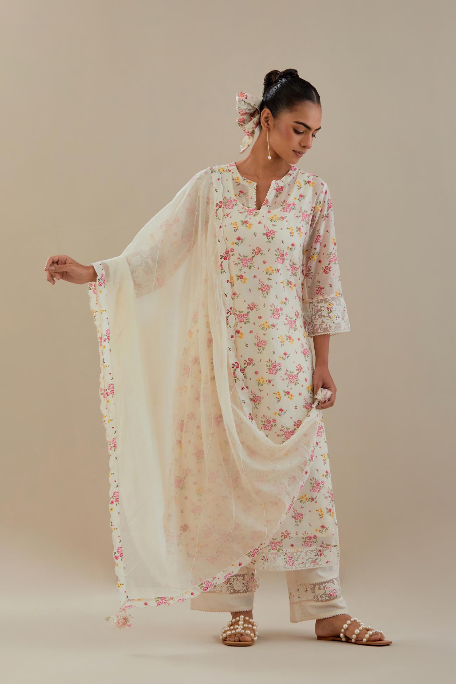 Off white cotton chanderi kurta set with small floral hand block print, highlighted with applique embroidery and ricrac lace.
