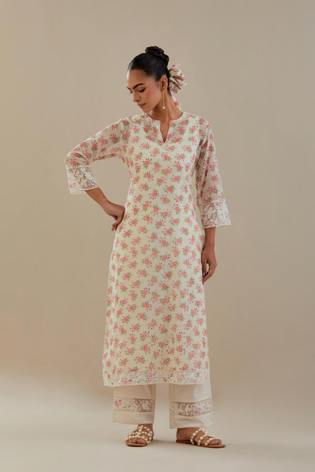 Off white cotton chanderi kurta set with small floral hand block print, highlighted with applique embroidery and ricrac lace.