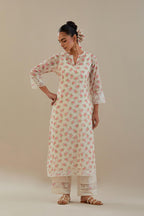 Off white cotton chanderi kurta set with small floral hand block print, highlighted with applique embroidery and ricrac lace.