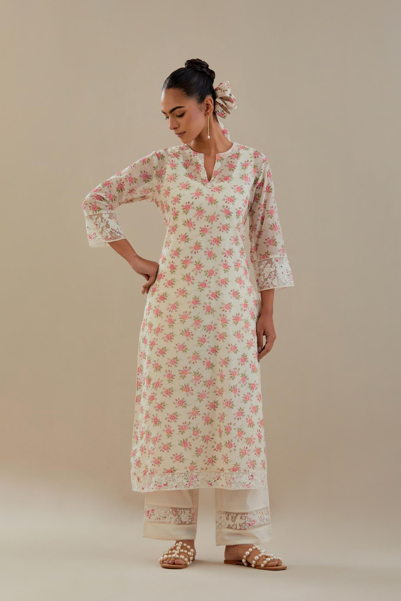 Off white cotton chanderi kurta set with small floral hand block print, highlighted with applique embroidery and ricrac lace.