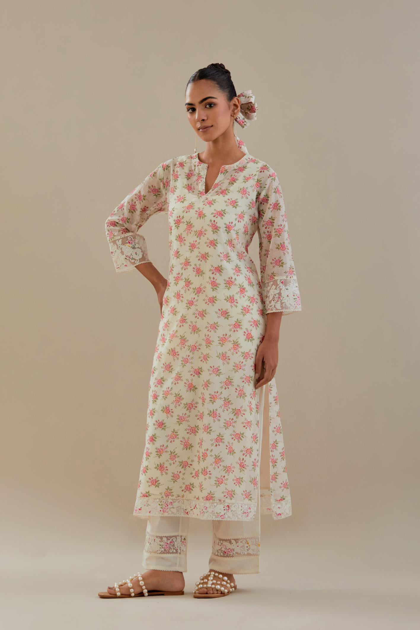 Off white cotton chanderi kurta set with small floral hand block print, highlighted with applique embroidery and ricrac lace.