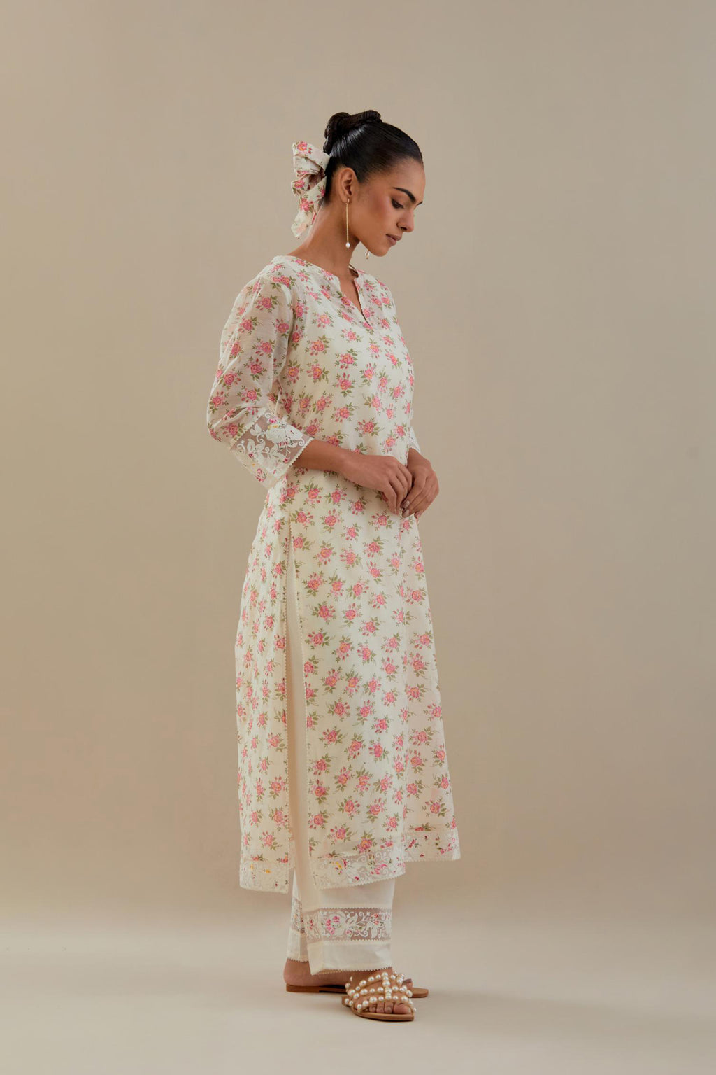 Off white cotton chanderi kurta set with small floral hand block print, highlighted with applique embroidery and ricrac lace.