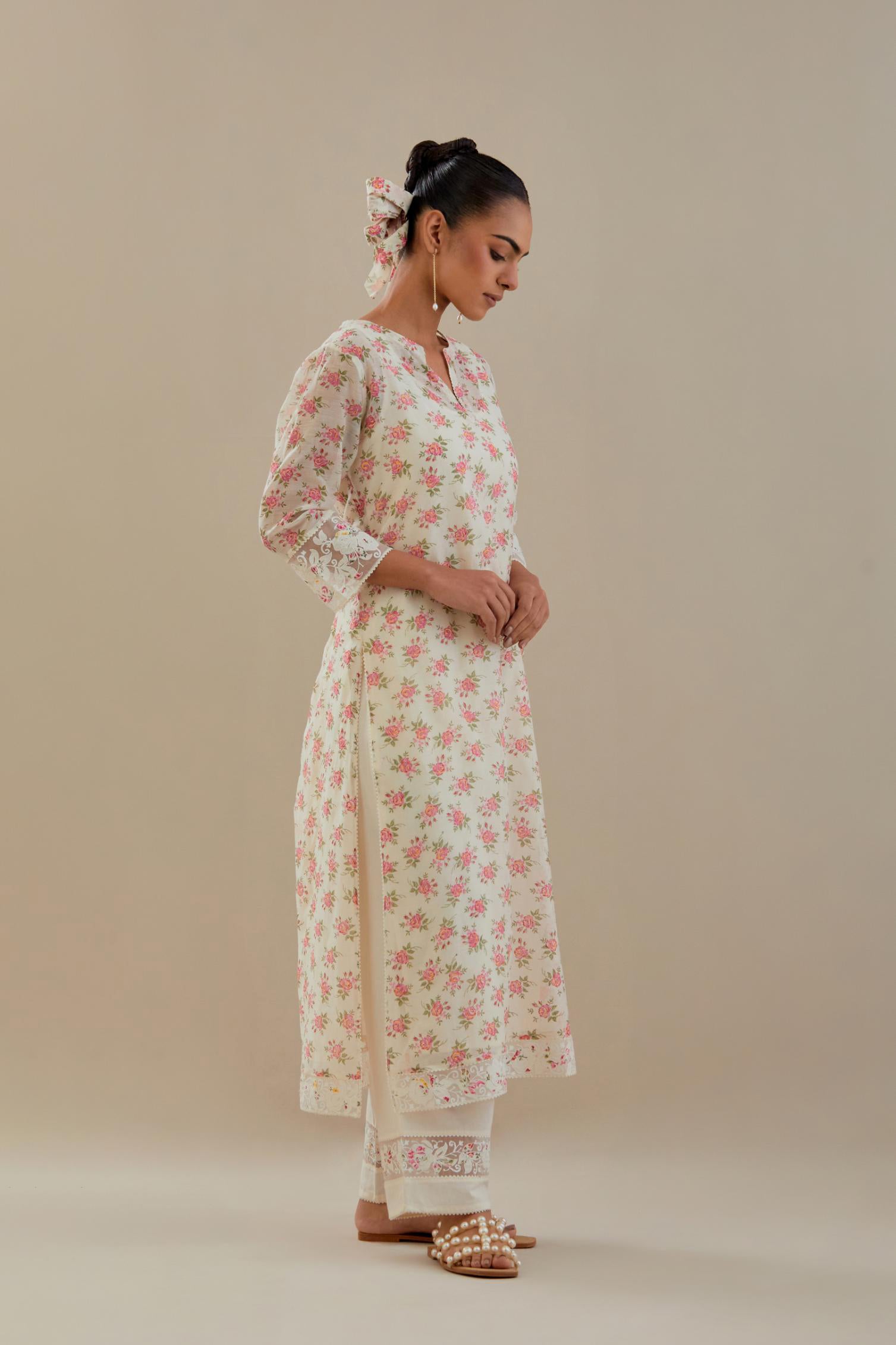 Off white cotton chanderi kurta set with small floral hand block print, highlighted with applique embroidery and ricrac lace.