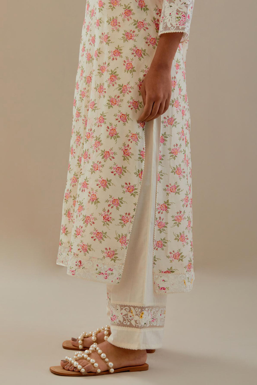 Off white cotton chanderi kurta set with small floral hand block print, highlighted with applique embroidery and ricrac lace.