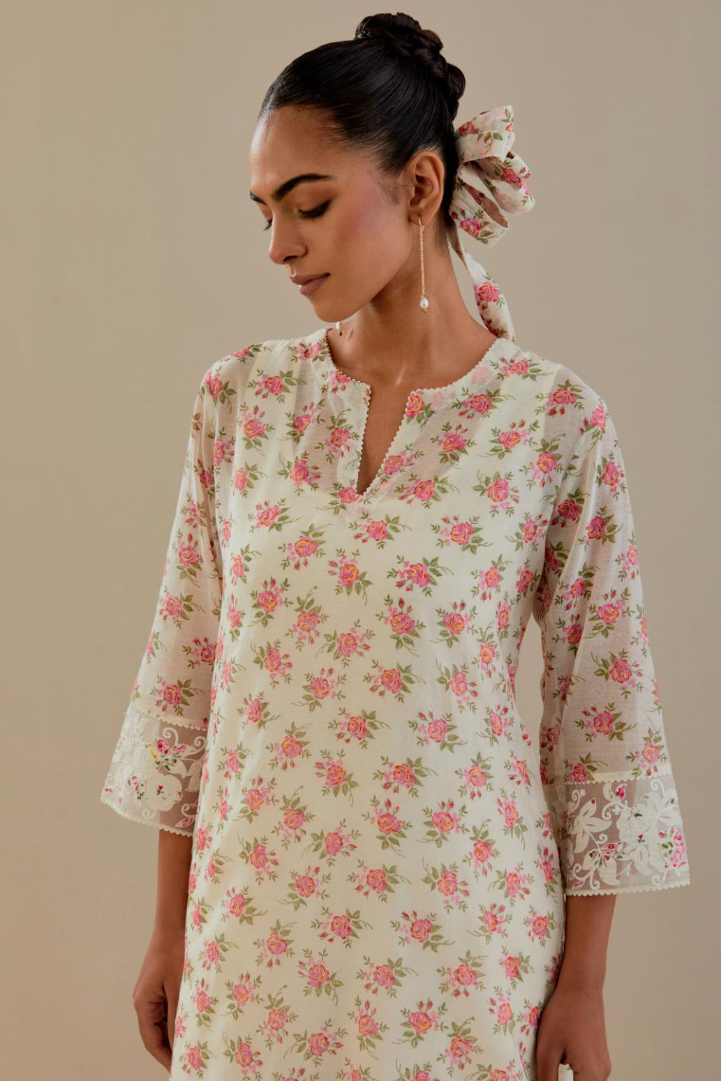 Off white cotton chanderi kurta set with small floral hand block print, highlighted with applique embroidery and ricrac lace.