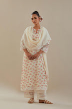 Off white cotton chanderi kurta set with small floral hand block print, highlighted with applique embroidery and ricrac lace.