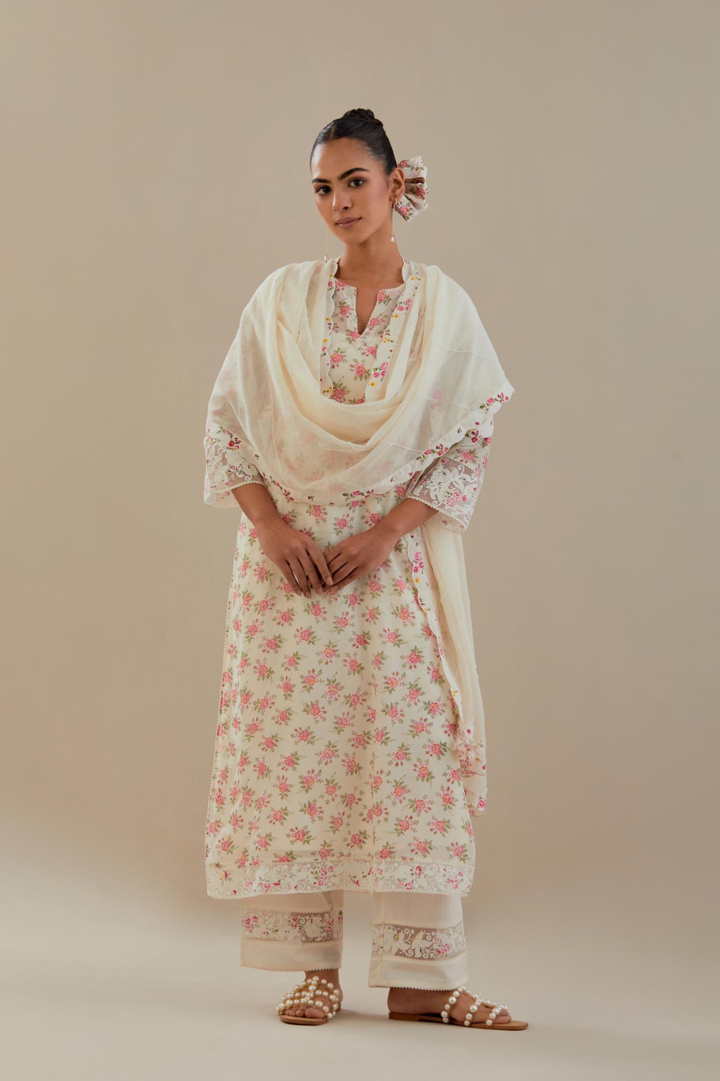 Off white cotton chanderi kurta set with small floral hand block print, highlighted with applique embroidery and ricrac lace.