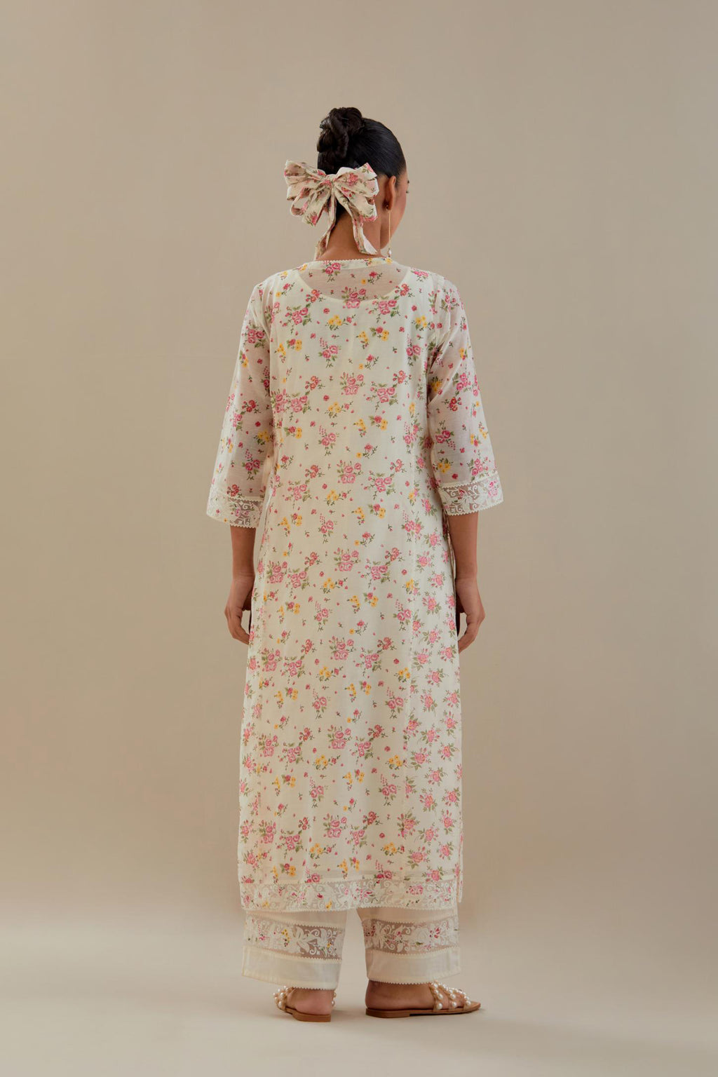 Off white cotton chanderi kurta set with small floral hand block print, highlighted with applique embroidery and ricrac lace.
